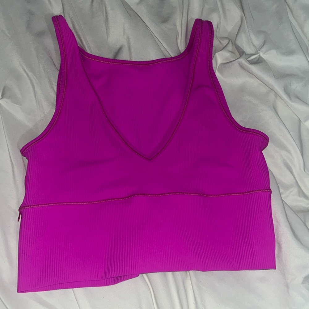 This is a Lululemon size 6 magenta V cut top.